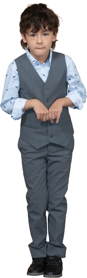 Front view of a cute boy in grey suit looking at camera