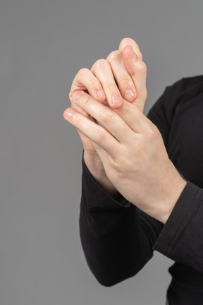 Close-up view of hands being sanitized