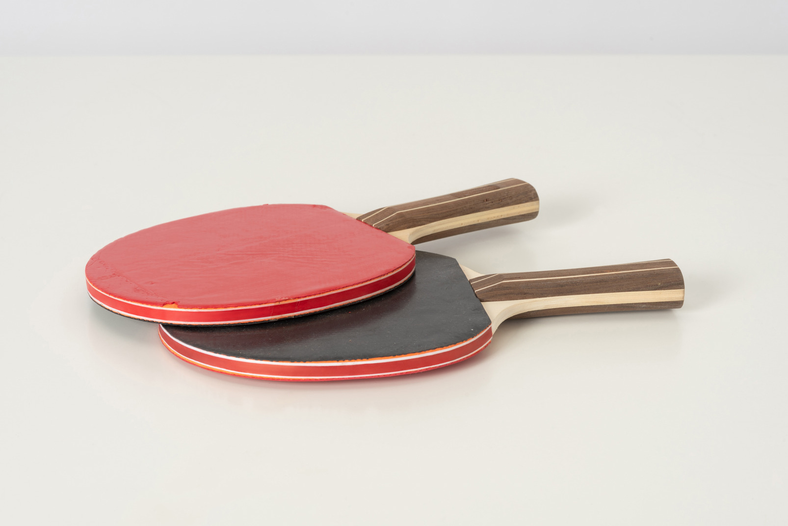 Red tennis rackets on a white background