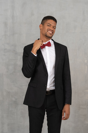 Young man in suit feeling discomfort