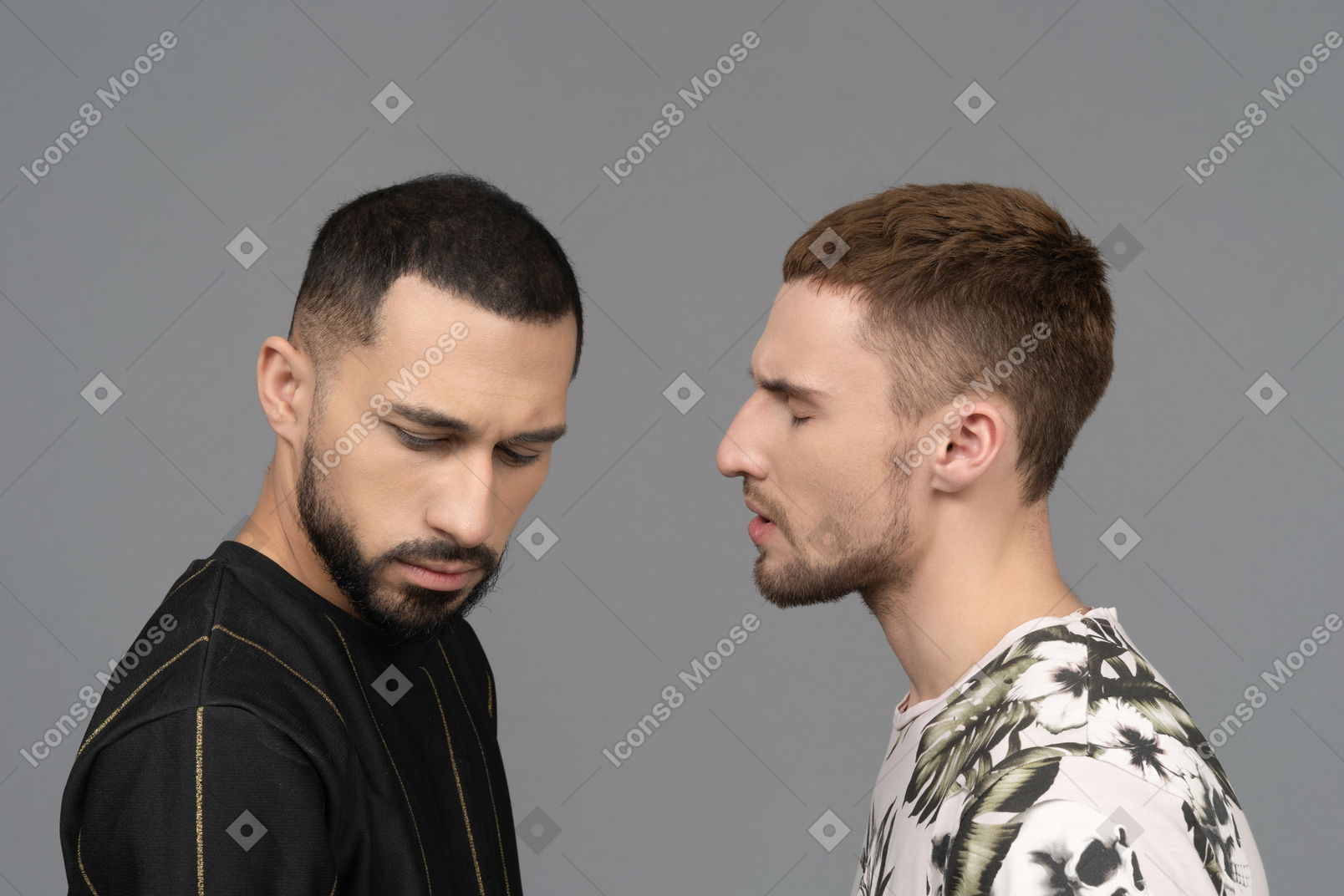 Close-up of a male couple looking stressed as if they are arguing