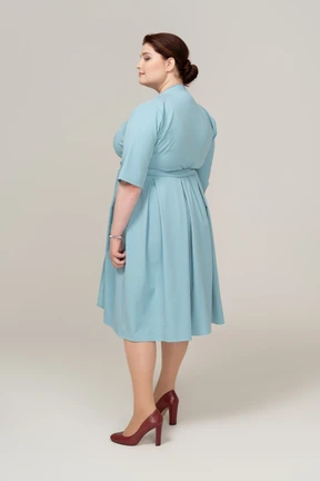 Rear view of a woman in blue dress
